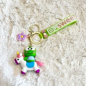Sanrio Kuropi in a Unicorn Keychain Wristlet Bag Charm